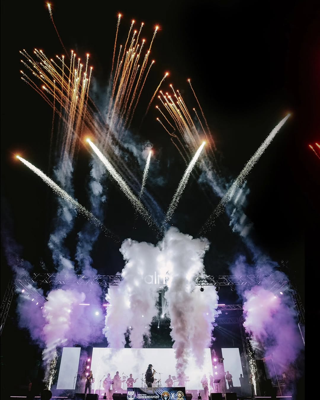 Live performers on the CEREBREXIA 2025 stage with production effects
